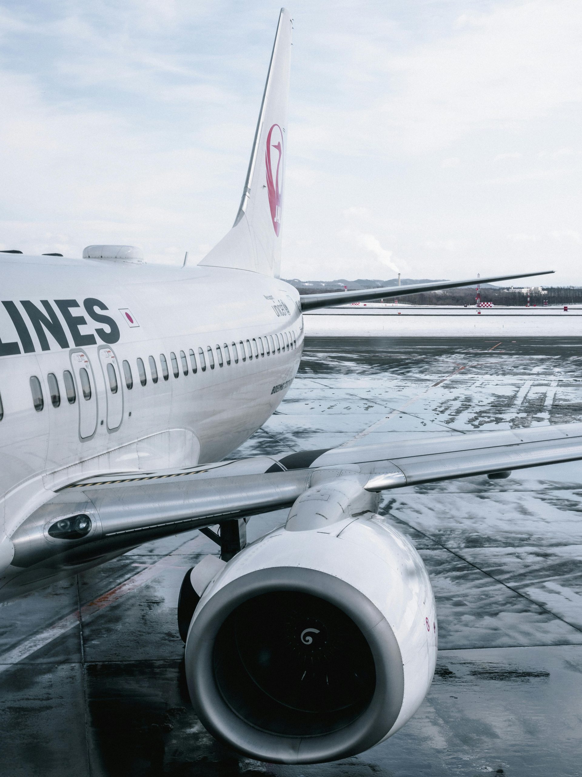 pexels photo 1928067 1928067 Close-up of an airliner on a wet runway after rain with reflections on the tarmac.