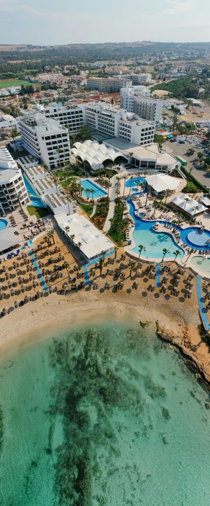 pexels photo 8332801 8332801 Stunning aerial shot of a beachfront resort in Cyprus, showcasing turquoise waters and modern amenities.